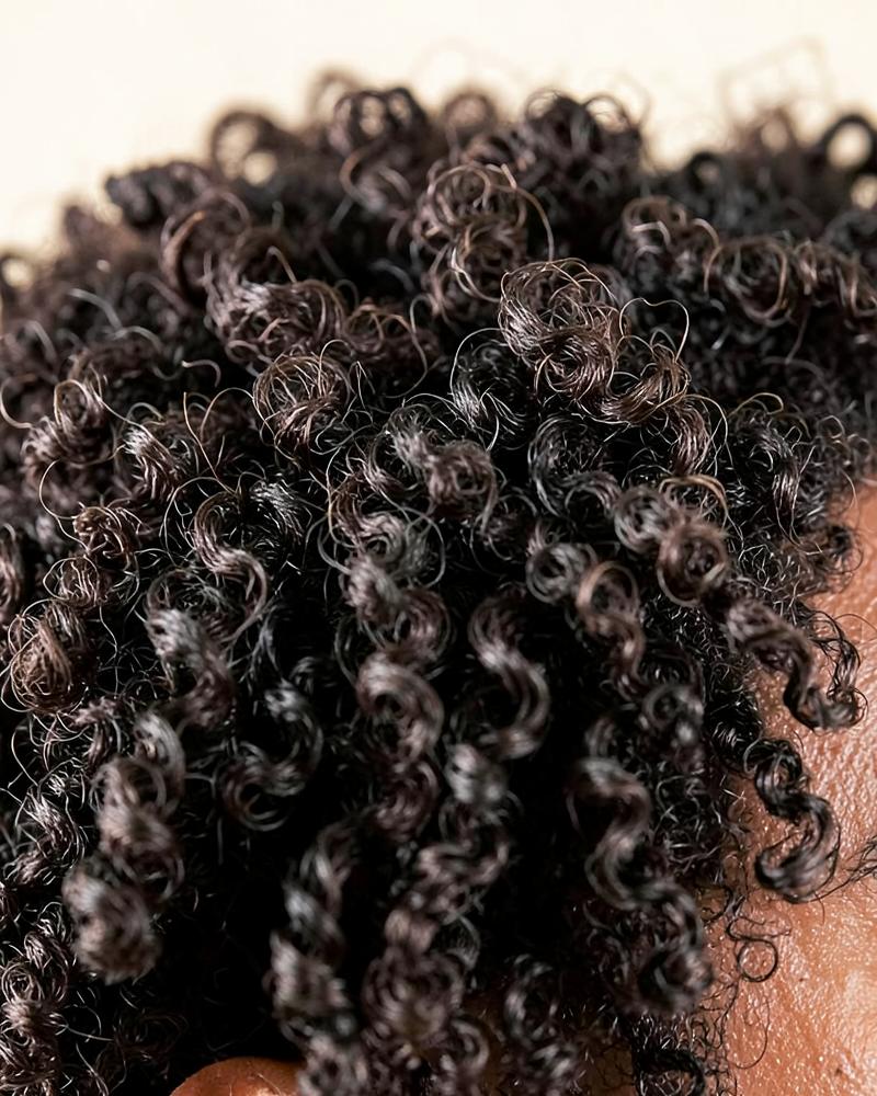 Coily men's hair texture close-up
